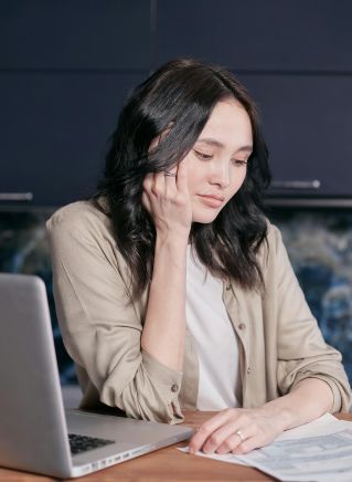 Stressed Woman Looking at Documents